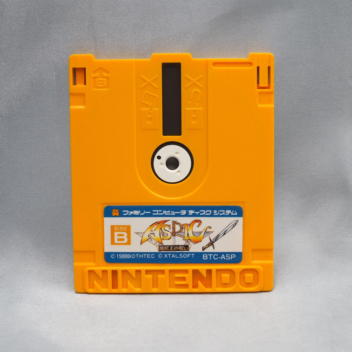 Three viewpoints in one Famicom Disk System game: overhead map, first-person dungeons, side-view battles. Aspic (1988) is a J — photo 2