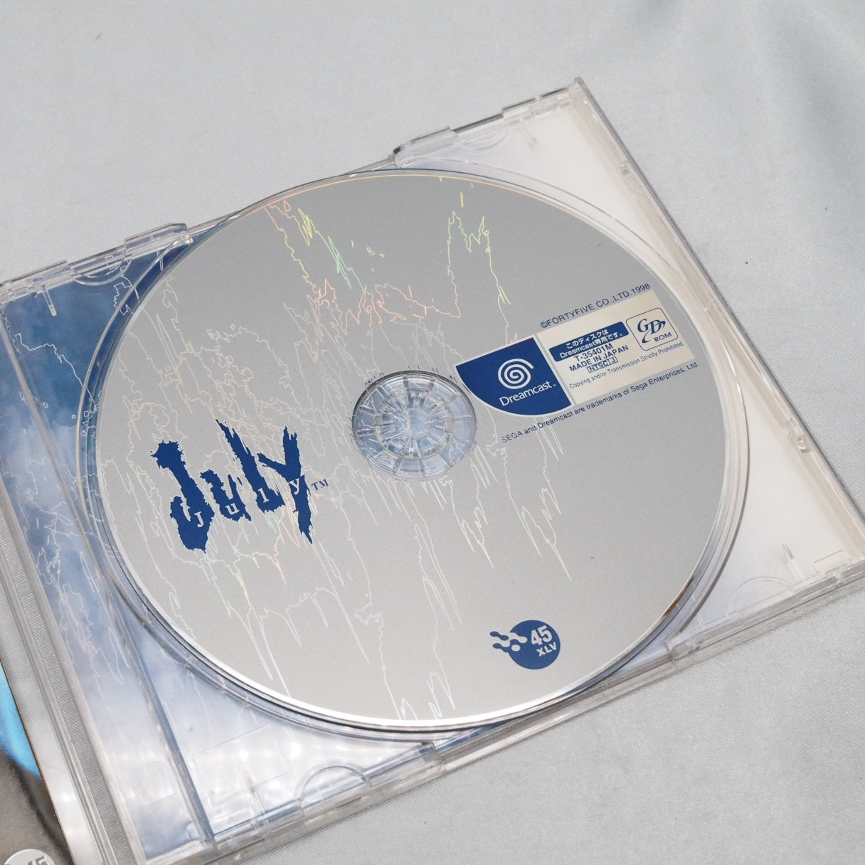 On Dreamcast launch day, November 27, 1998, this was already on the shelf. July (Dreamcast) — Japan-only visual novel by Fort — photo 2