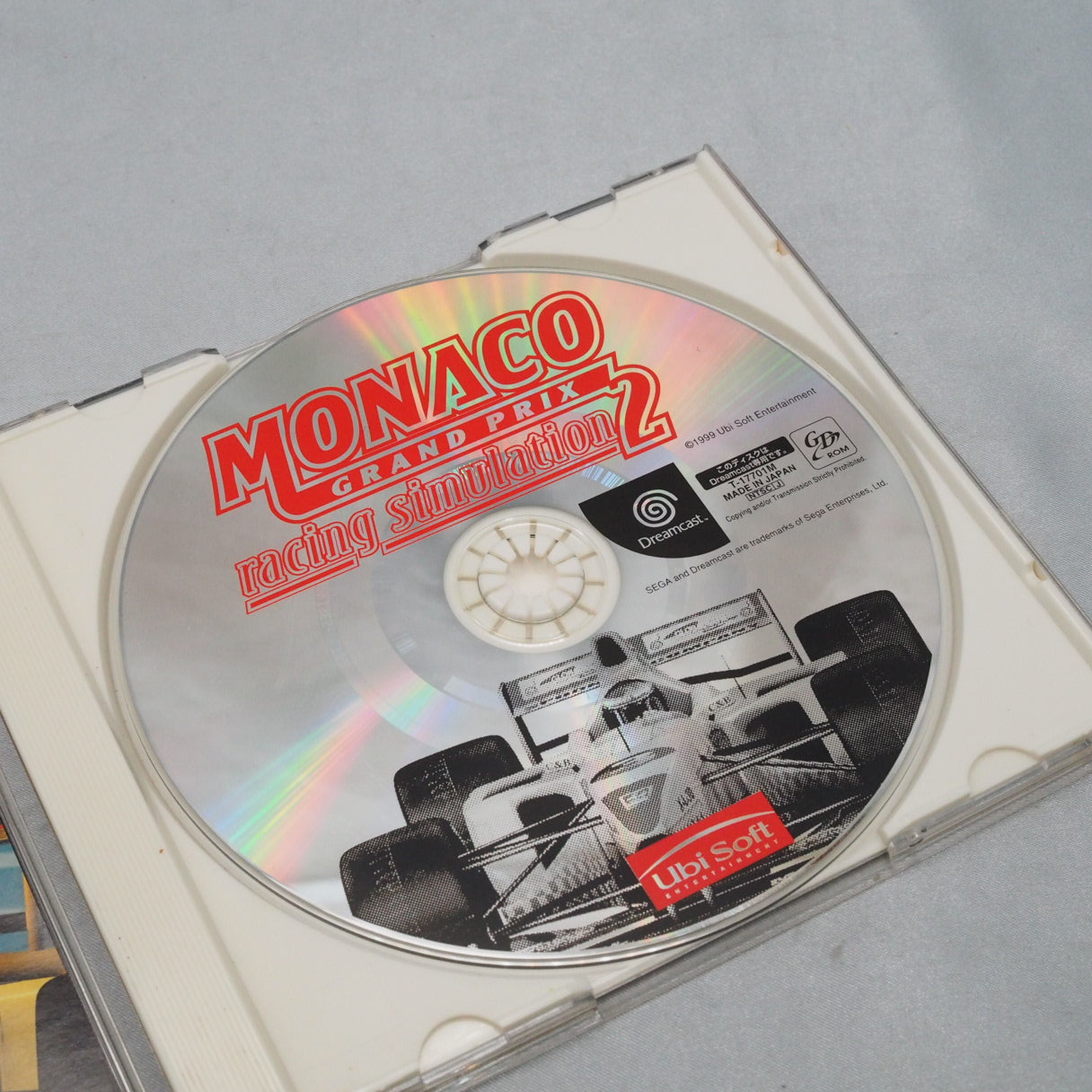 Ubisoft licensed the Monaco circuit but not the drivers — so the 1999 grid runs under fictional names. Dreamcast F1 sim, Japa — photo 2