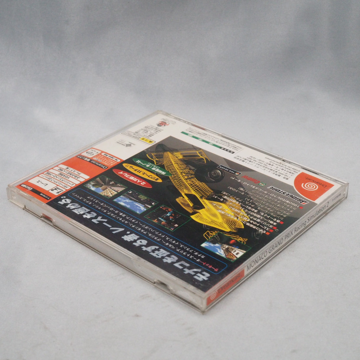 Ubisoft licensed the Monaco circuit but not the drivers — so the 1999 grid runs under fictional names. Dreamcast F1 sim, Japa — photo 12