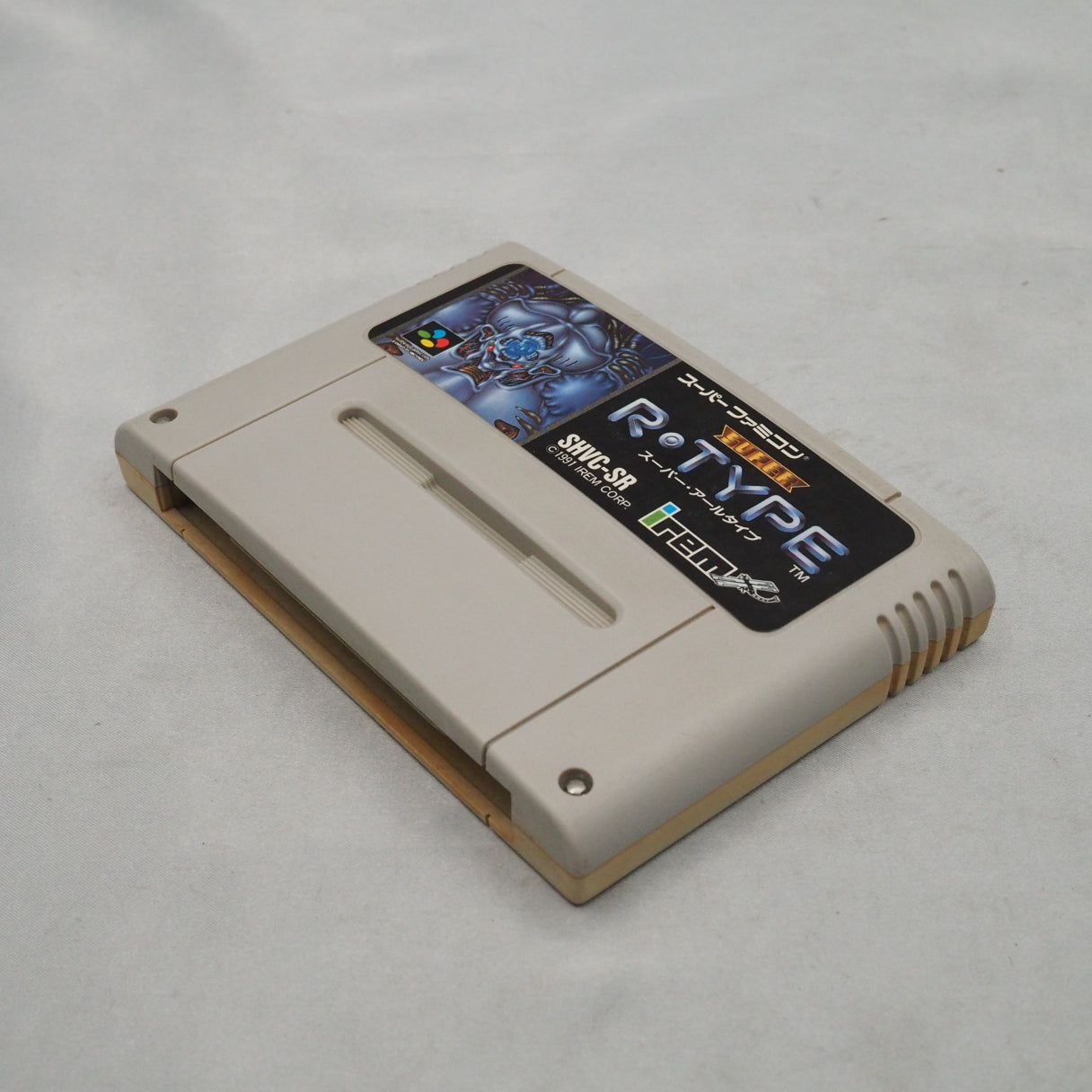 No continues. Death sends you back to a mid-stage checkpoint. Irem's Super R-Type (1991, Super Famicom) — considered brutal e — photo 5